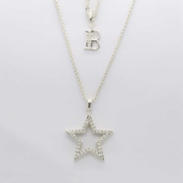 Silver Stone Set Star Pendant Hanging On 22" Silver Chain