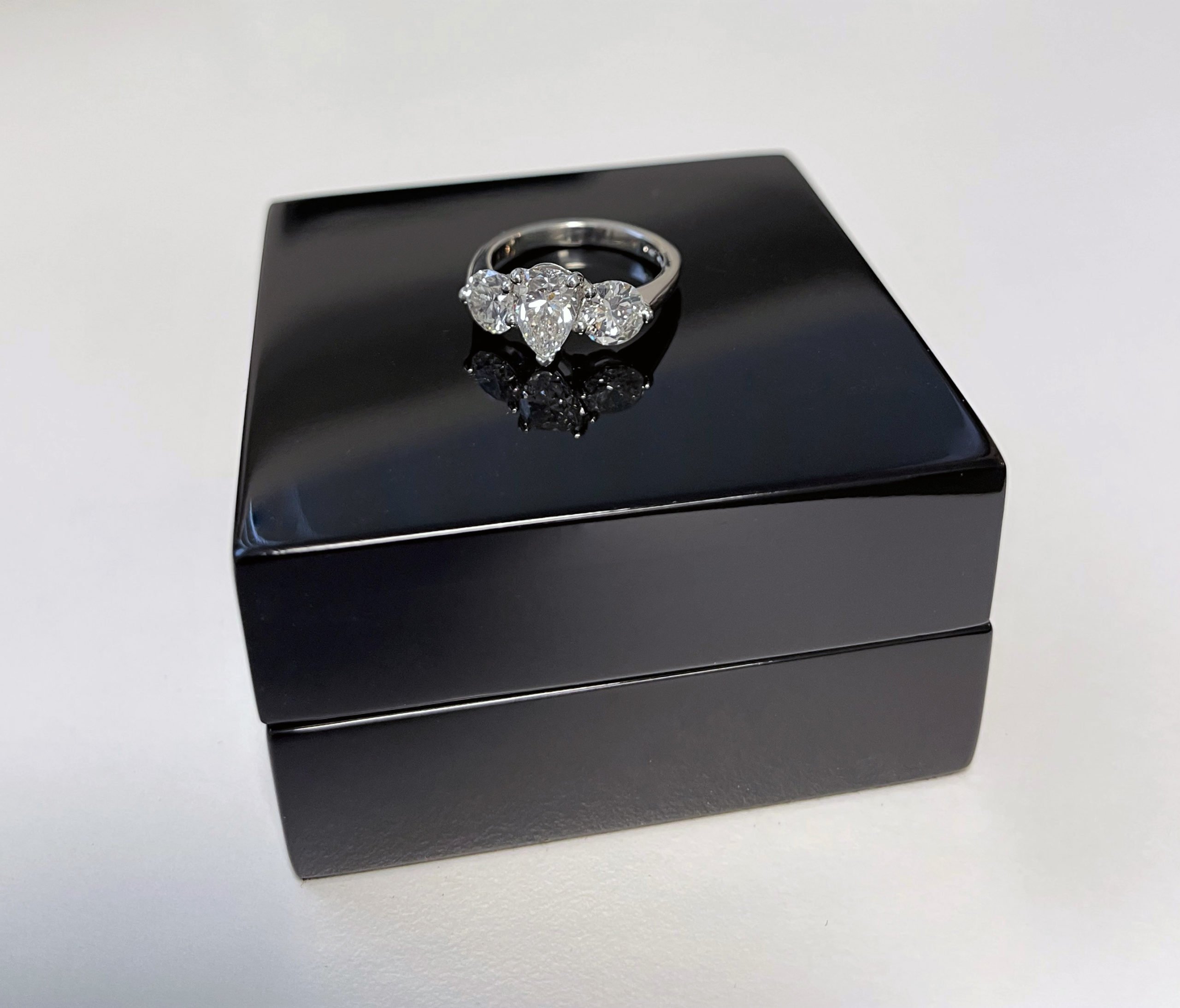 Ladies Trilogy Ring with a Central Pear-Shaped Diamond