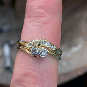 9ct gold bespoke made wedding band set with diamonds in a rub over setting to sit flush with engagement ring